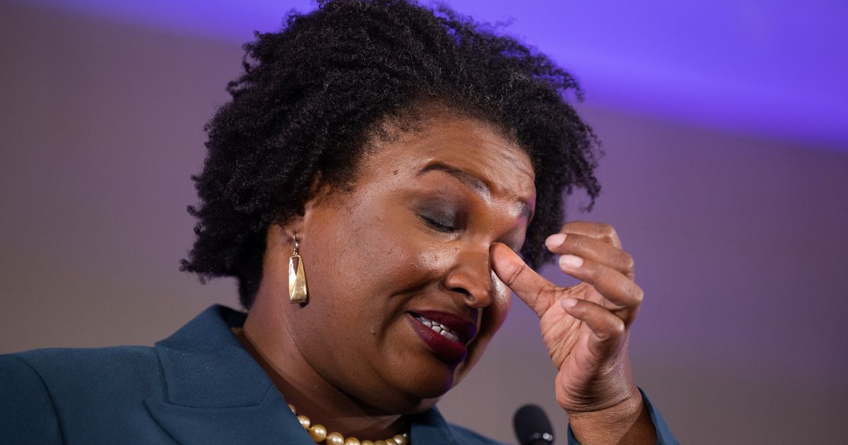 Democratic gubernatorial candidate Stacey Abrams wipes her eye during a concession speech to supporters during an election-night party in Atlanta, Georgia, on Nov. 8, 2022.
