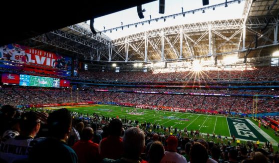 Fans watch Super Bowl LVII between the Kansas City Chiefs and the Philadelphia Eagles at State Farm Stadium in Glendale, Arizona, on Sunday.