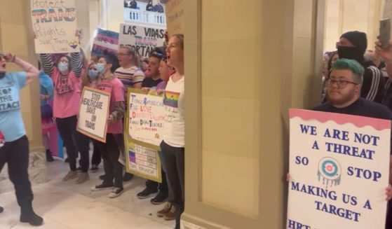 On Monday, protestors who disagree with an Oklahoma bill that bans "gender transition" surgery on minors, invaded the state Capitol building, chanting "We are Oklahoma."