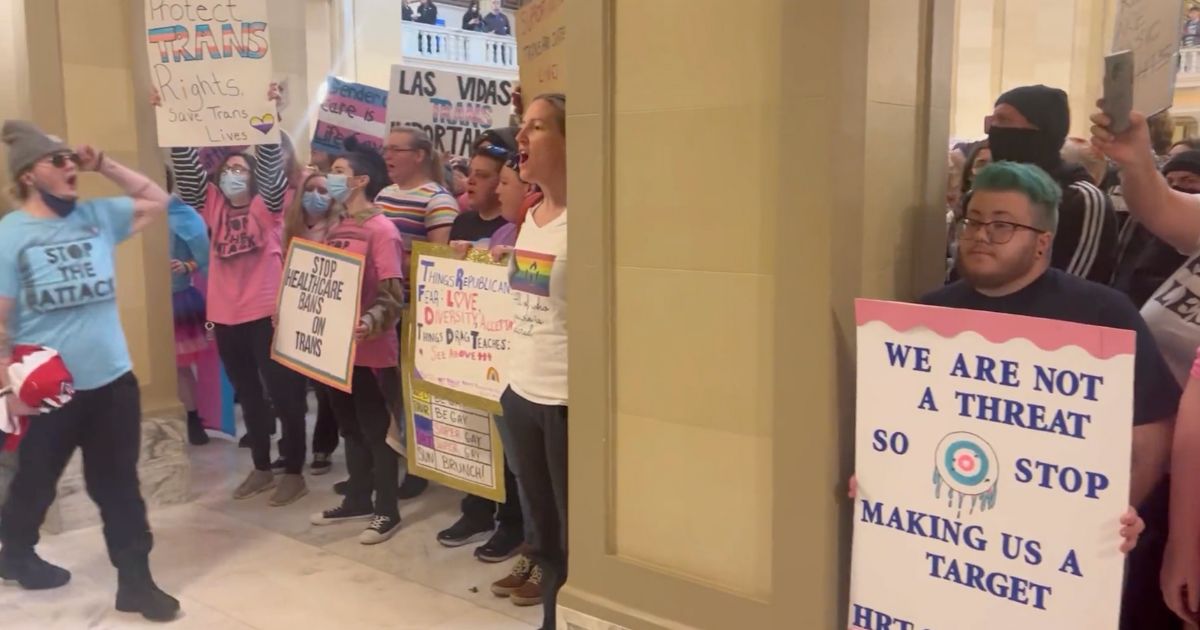 On Monday, protestors who disagree with an Oklahoma bill that bans "gender transition" surgery on minors, invaded the state Capitol building, chanting "We are Oklahoma."