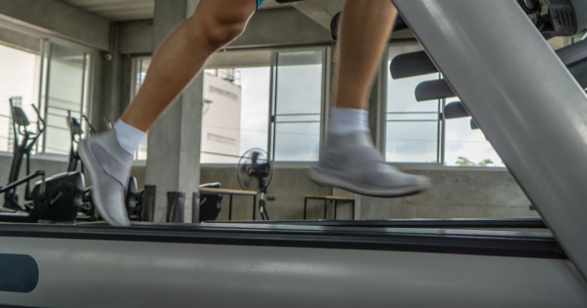 This stock photo depicts someone running on a treadmill.