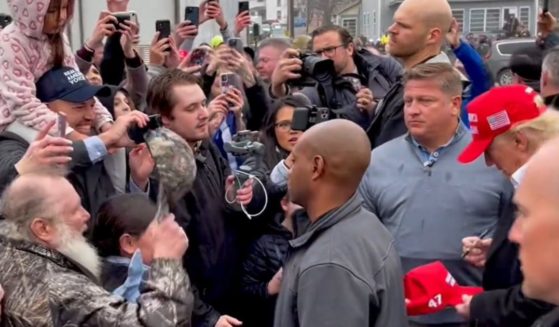 Viewers quickly spotted the new detail on the right of the MAGA hats Trump was signing.