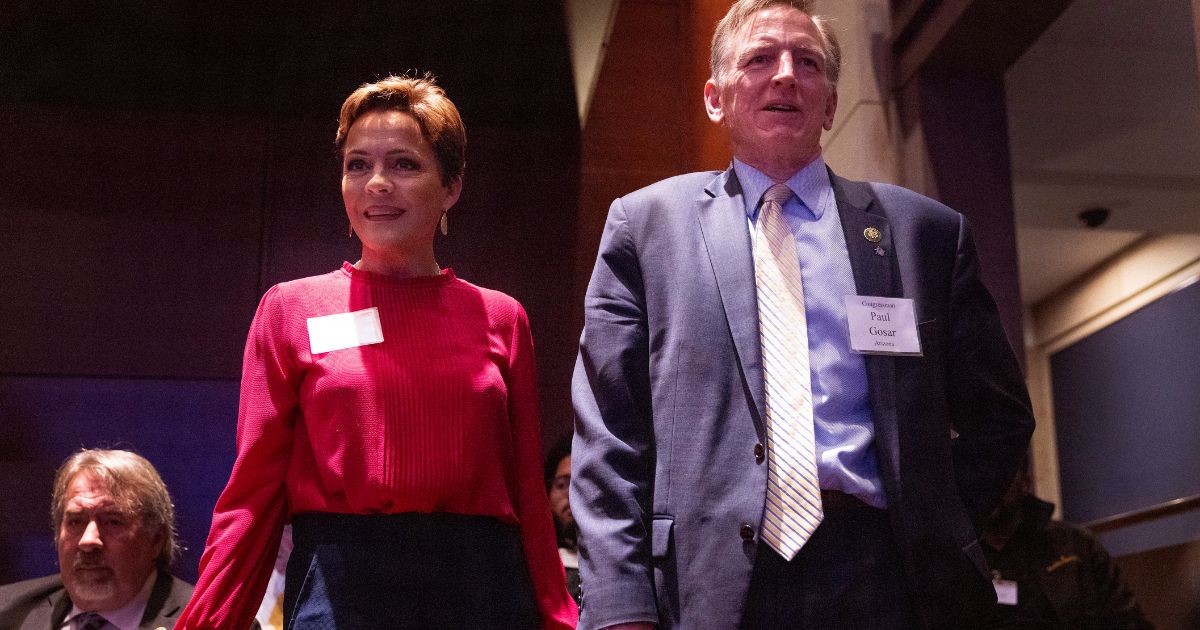 Former gubernatorial candidate Kari Lake and U.S. Rep. Paul Gosar, a fellow Republican from Arizona, stand together at the National Prayer Breakfast at the U.S. Capitol on Feb. 2.