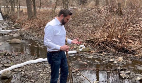Ohio Sen. J.D. Vance visits a creek near East Palestine, Ohio.