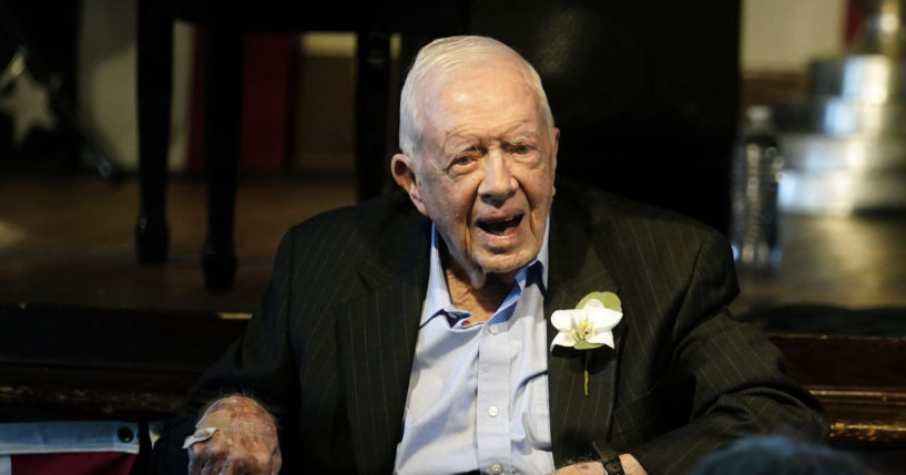 Former President Jimmy Carter reacts as his wife Rosalynn Carter speaks during a reception to celebrate their 75th wedding anniversary on July 10, 2021, in Plains, Georgia.