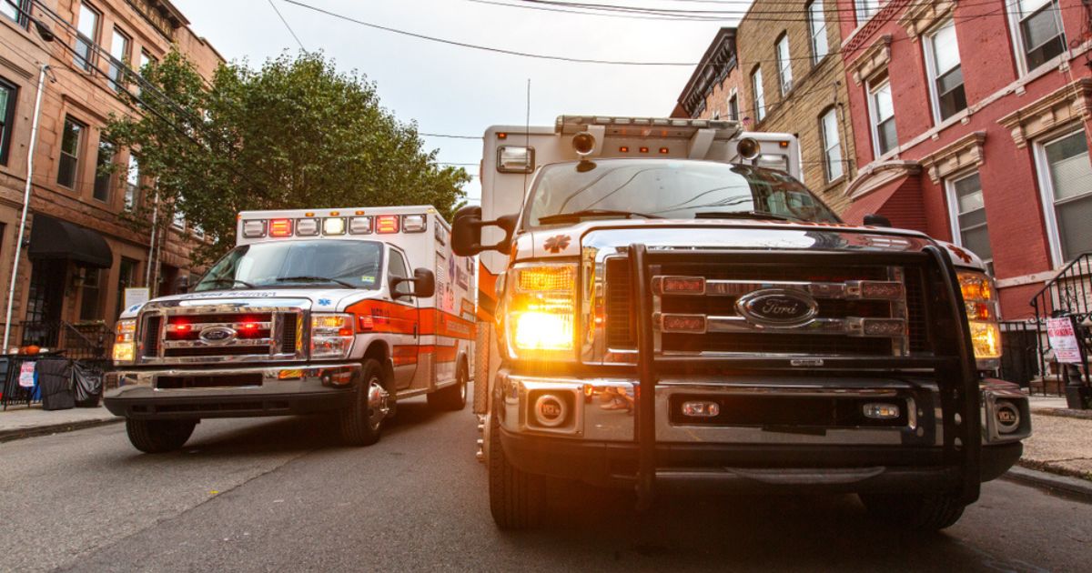 Two ambulances are seen in the above stock image.