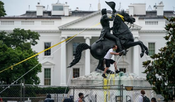 Protesters attempt to pull down the statue of Andrew Jackson in Lafayette Square near the White House on June 22, 2020 in Washington, DC.