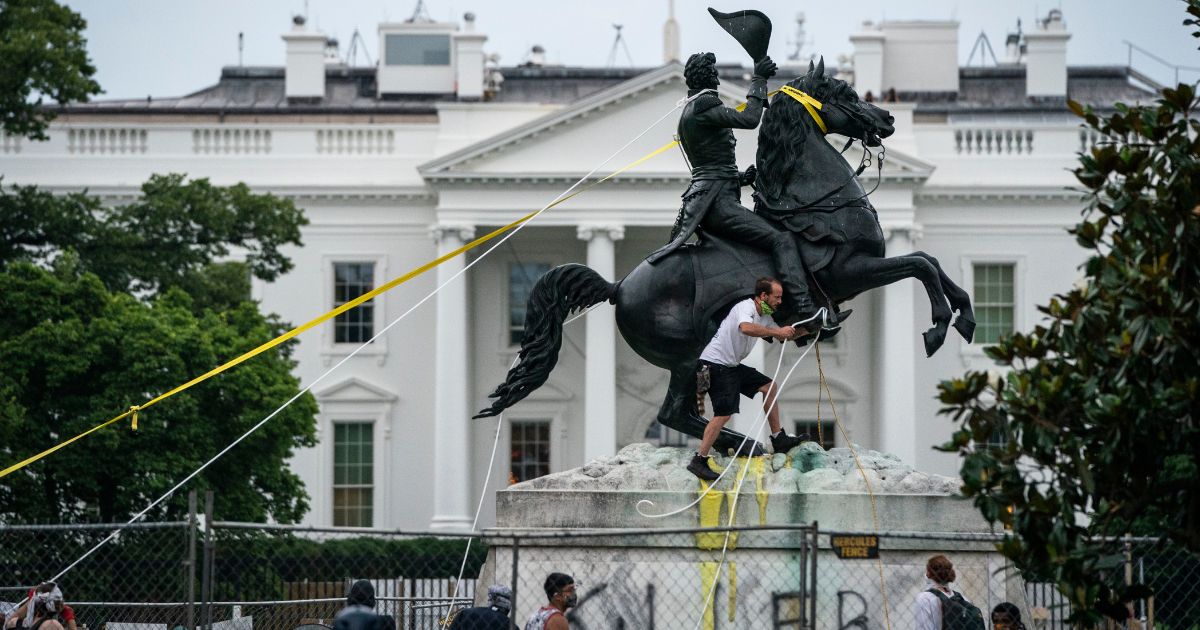 Protesters attempt to pull down the statue of Andrew Jackson in Lafayette Square near the White House on June 22, 2020 in Washington, DC.