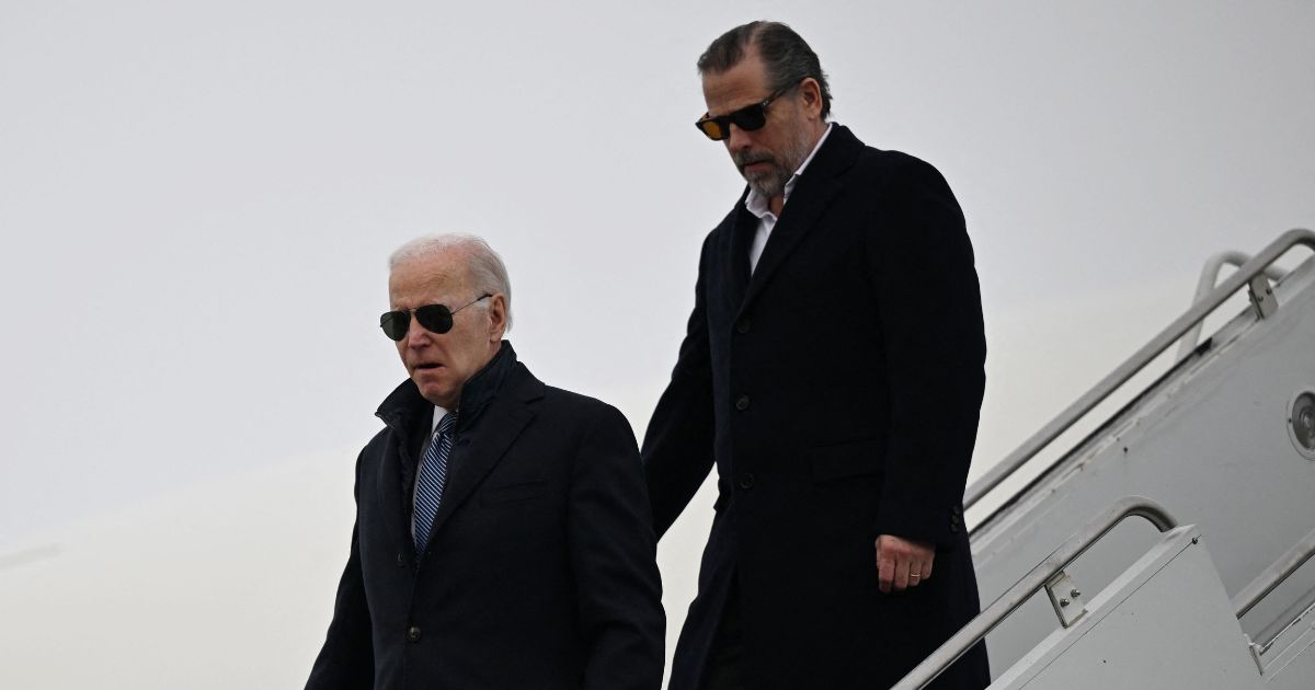 President Joe Biden, left, with son Hunter Biden, right, arrives at Hancock Field Air National Guard Base in Syracuse, New York, on Feb. 4.