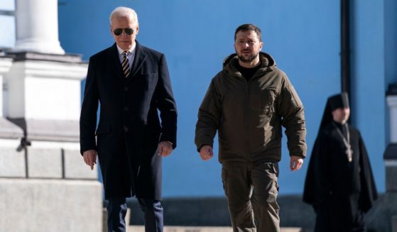 President Joe Biden, left, walks with Ukrainian President Volodymyr Zelenskyy, right, at St. Michael's Golden-Domed Cathedral during an unannounced visit, in Kyiv on Monday.