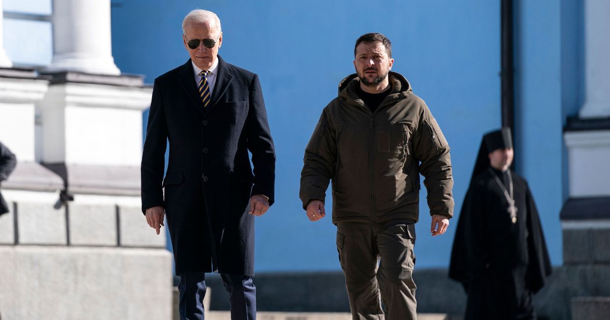 President Joe Biden, left, walks with Ukrainian President Volodymyr Zelenskyy, right, at St. Michael's Golden-Domed Cathedral during an unannounced visit, in Kyiv on Monday.