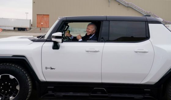 President Joe Biden test drives an electric Hummer at the General Motors Factory ZERO electric vehicle assembly plant in Detroit on Nov. 17, 2021.