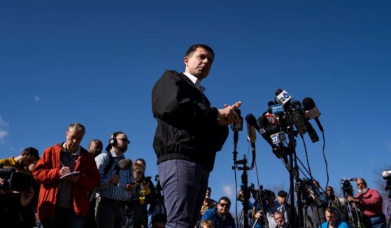 U.S. Transportation Secretary Pete Buttigieg delivers remarks to the press as he visited the site of the Norfolk Southern train derailment on Thursday in East Palestine, Ohio.