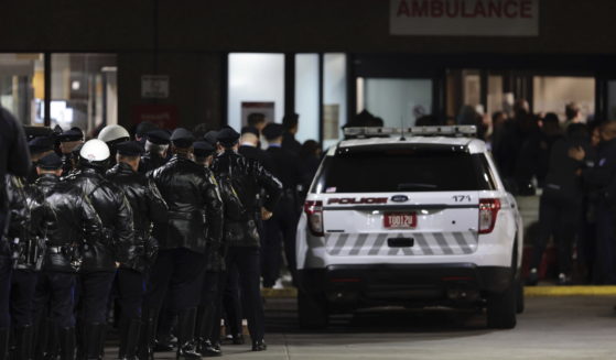 Police gather at Temple University Hospital following a fatal shooting of a Temple University police officer near the campus in Philadelphia on Saturday.