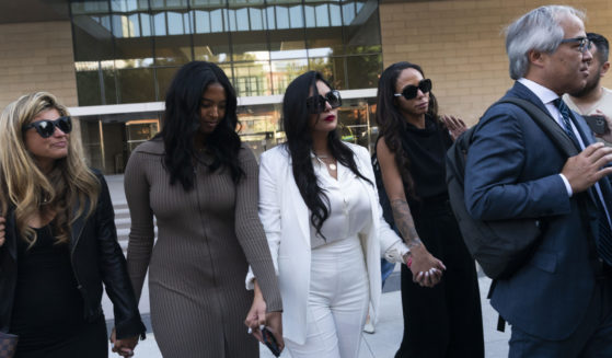 Vanessa Bryant, center, Kobe Bryant's widow, leaves a federal courthouse with her daughter Natalia, center left, and soccer player Sydney Leroux, center right, in Los Angeles on Aug. 24.