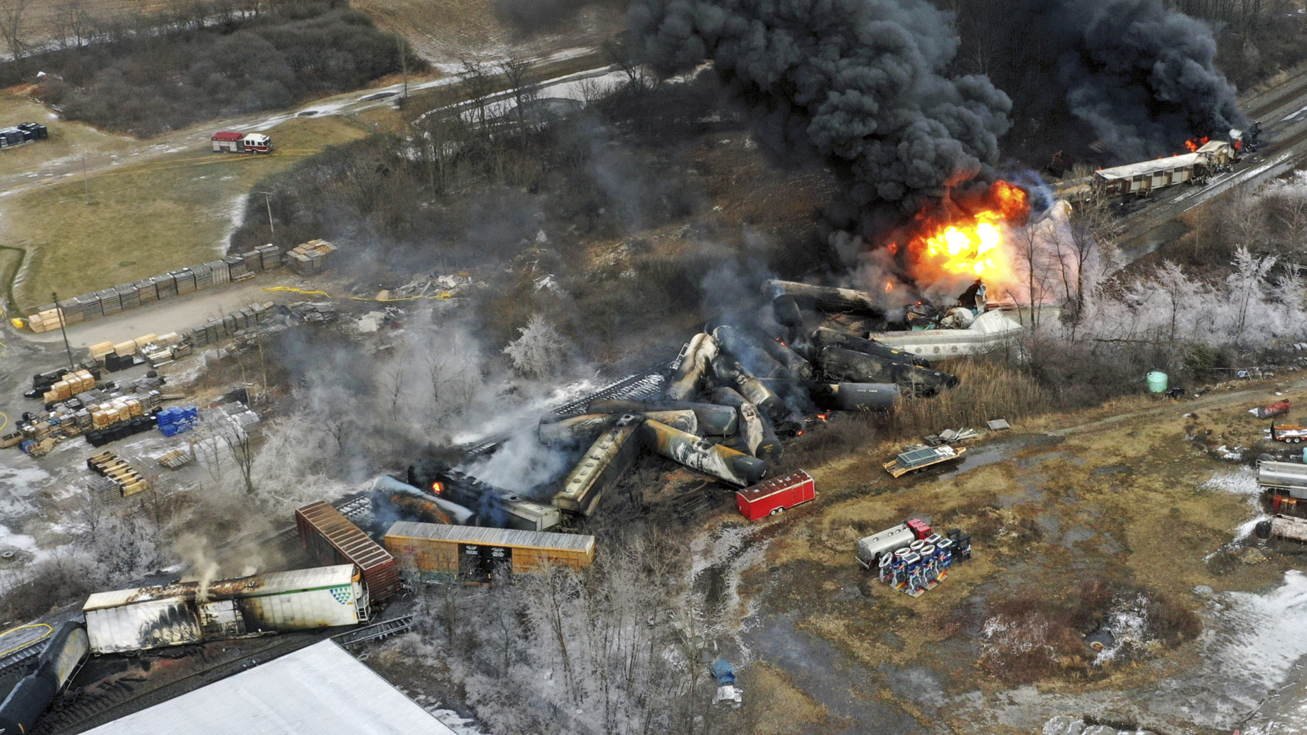portions of a Norfolk and Southern freight train that derailed still burning