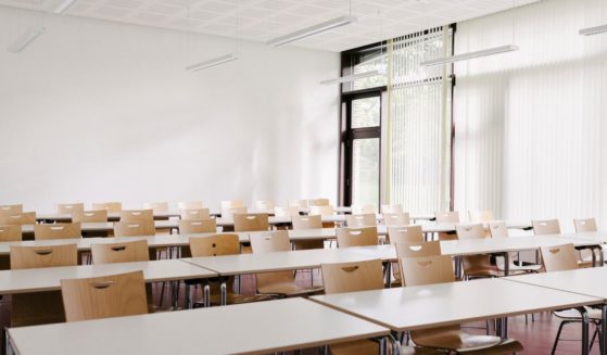The above stock image is of a classroom.