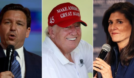 Florida Gov. Ron DeSantis, left, and former South Carolina Gov. Nikki Haley, right, don't match up against President Joe Biden in a hypothetical presidential contest, according to a poll from Emerson College. Former President Donald Trump, center, would beat Biden, the poll found.