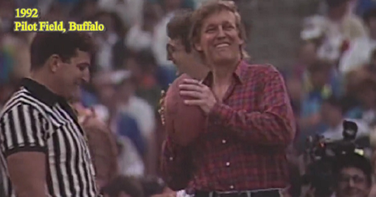 Then-private citizen/celebrity Donald Trump prepares to throw a football at a 1992 charity event.