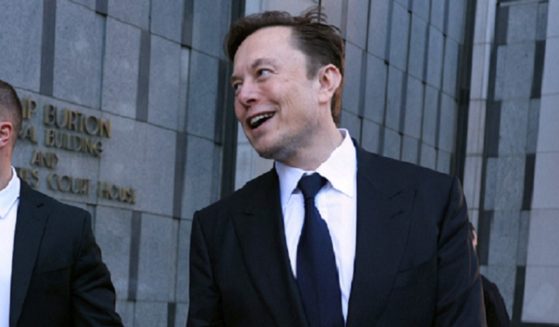 Twitter owner Elon Musk grins as he leaves a San Francisco courtroom last week.