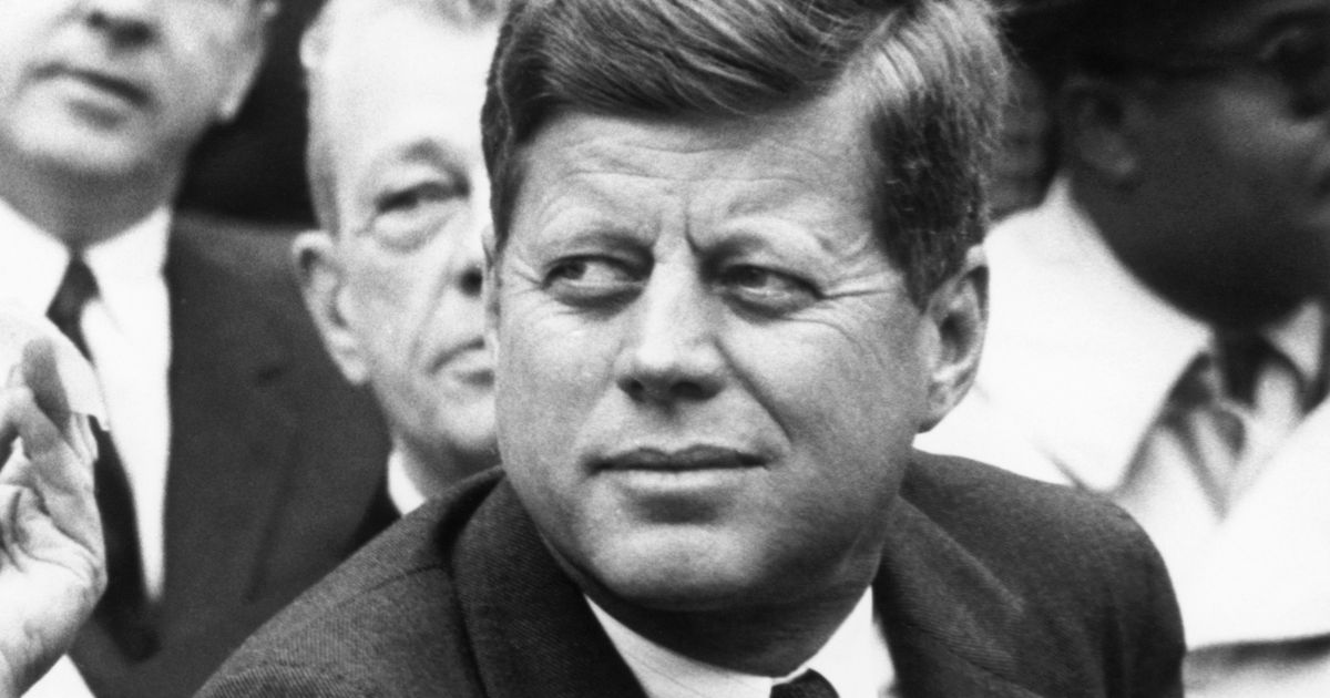 Then President John F. Kennedy watches the Opening Day game between the Washington Senators and Detroit Tigers at D.C. Stadium on April 9, 1962, in Washington, D.C.
