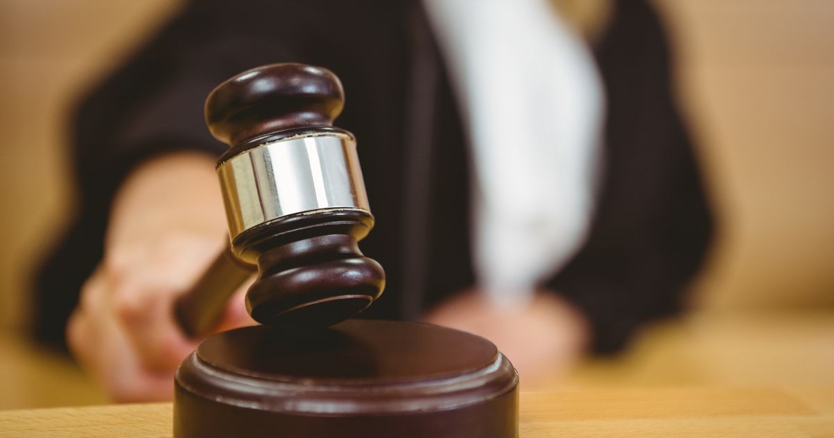 A judge bangs a gavel in the above stock image.
