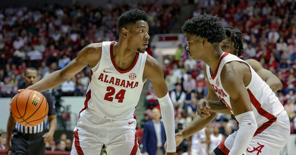 Brandon Miller #24 of the Alabama Crimson Tide looks for a path to the basket during the first half against the Georgia Bulldogs at Coleman Coliseum on Feb. 18 in Tuscaloosa, Alabama.