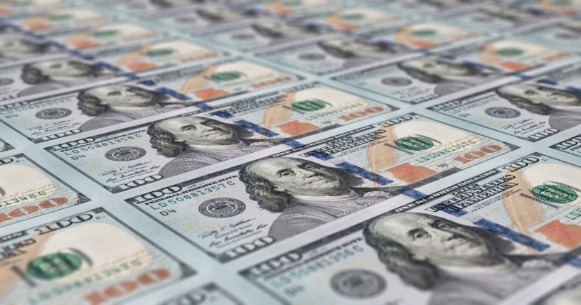 Hundred-dollar bills are seen in the above stock image.