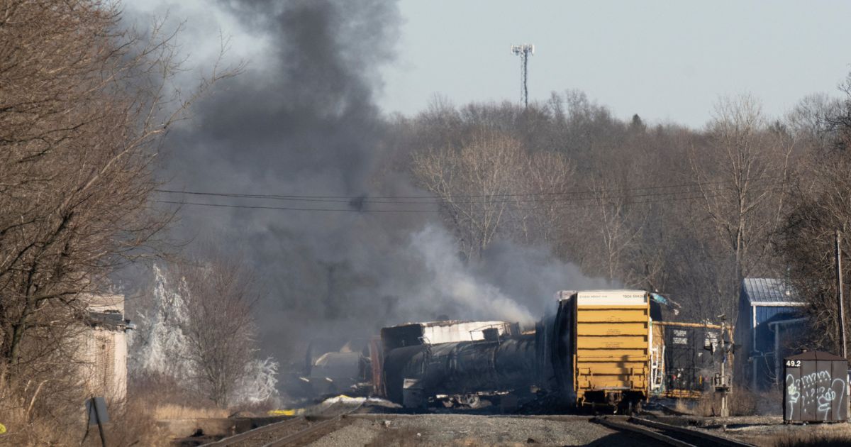 Smoke rises from a derailed cargo train in East Palestine, Ohio, on Feb. 4.