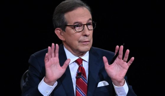 Chris Wallace moderates the first presidential debate between then-President Donald Trump and Democratic nominee Joe Biden at the Health Education Campus of Case Western Reserve University in Cleveland on Sept. 29, 2020.