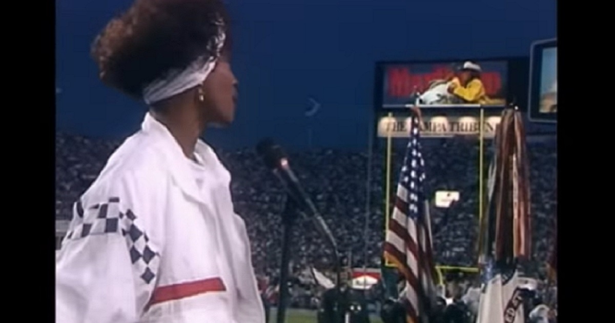 Superstar Whitney Houston performs "The Star-Spangled Banner" at the 1991 Super Bowl at Tampa Stadium in Tampa, Florida.