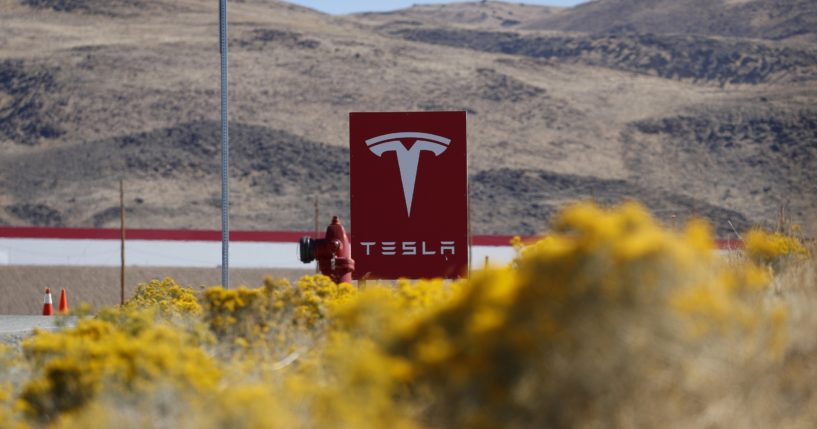 A sign marks the entrance to the Tesla Gigafactory in Sparks, Nevada, in this file photo from 2018. Tesla will get more than $330 million in tax breaks from Nevada to massively expand its vehicle battery facility east of Reno and add a new electric semi-truck factory.