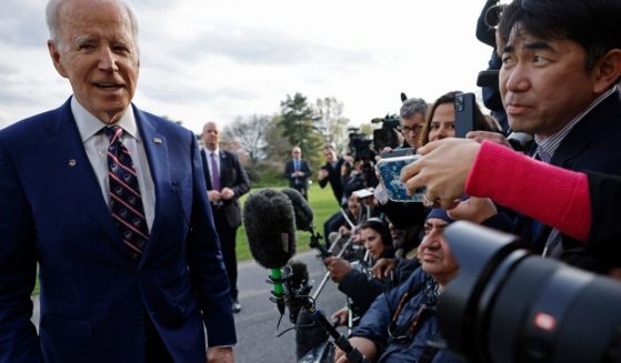 President Joe Biden briefly speaks with reporters as he returns to the White House in Washington on Tuesday.
