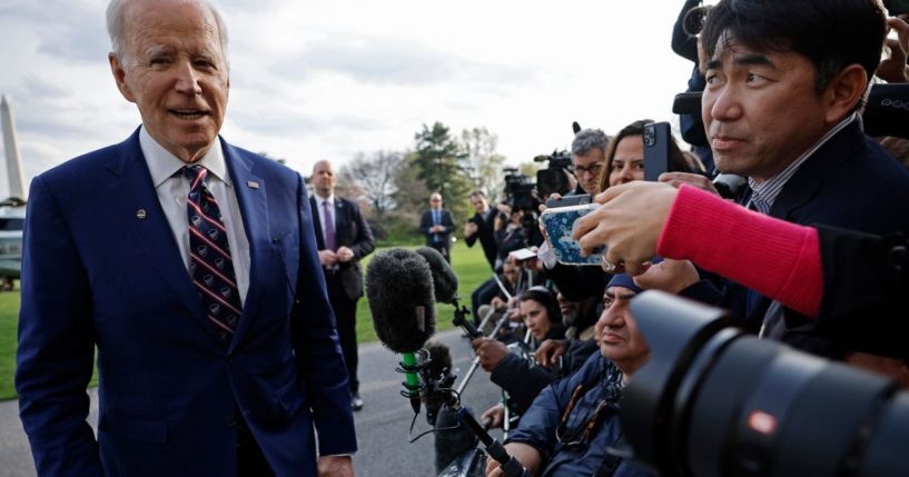 President Joe Biden briefly speaks with reporters as he returns to the White House in Washington on Tuesday.