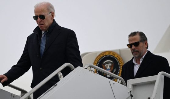 President Joe Biden, left, and son Hunter Biden arrive at Hancock Field Air National Guard Base in Syracuse, New York, on Feb. 4