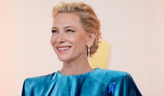 Actress Cate Blanchett sports a blue ribbon as she arrives for the Oscars at the Dolby Theatre in Los Angeles on Sunday.