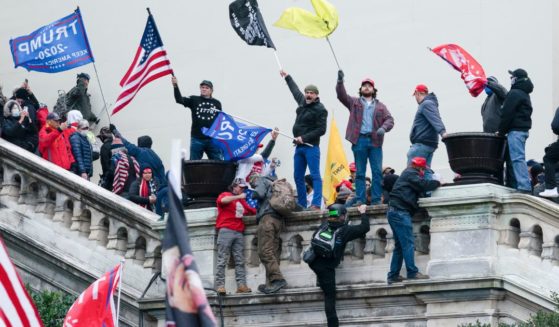 Protesters wave flags on the West Front of the U.S. Capitol in Washington, D.C., on Jan. 6, 2021.