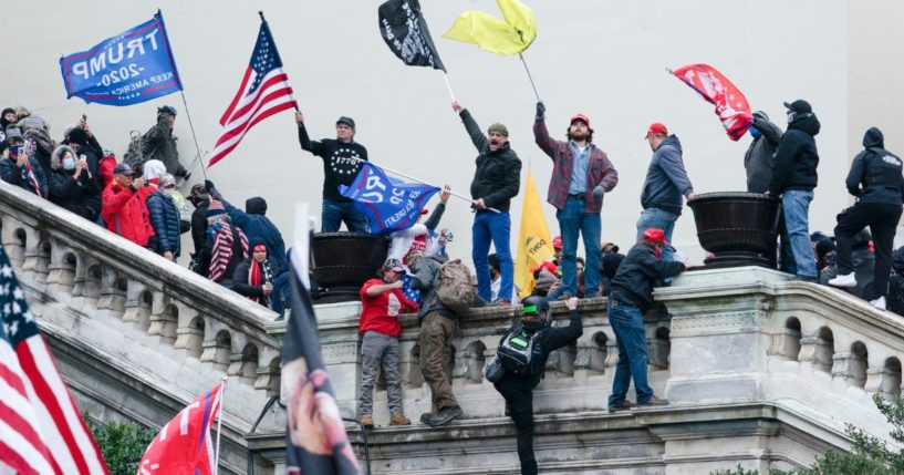 Protesters wave flags on the West Front of the U.S. Capitol in Washington, D.C., on Jan. 6, 2021.