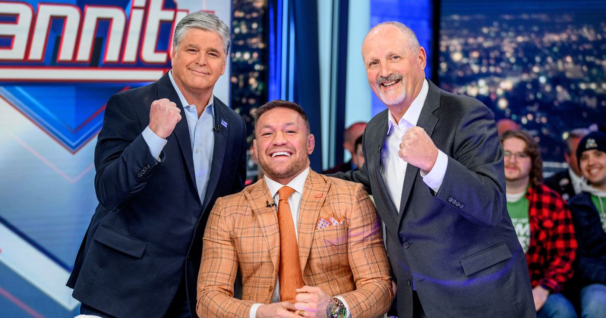 Sean Hannity, left, Conor McGregor, center, and Frank Siller, right, pose on the set of "Hannity" in New York City on Wednesday.
