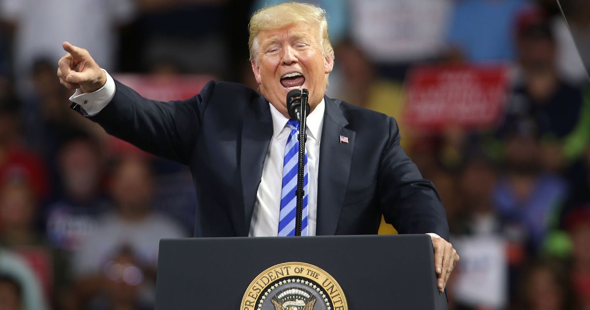 Then-President Donald Trump speaks at a rally in Charleston, West Virginia on Aug. 21, 2018.