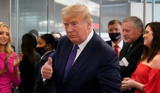 President Donald Trump gives a thumbs-up