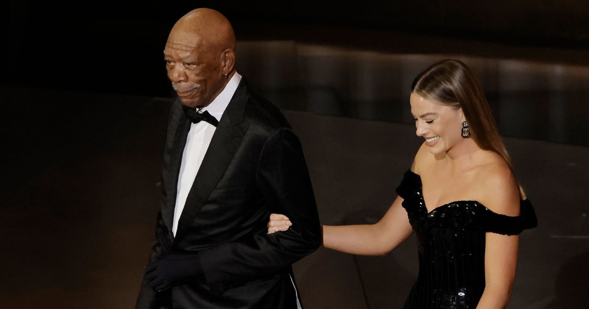 Morgan Freeman and Margot Robbie walk onstage during the 95th annual Academy Awards at the Dolby Theatre in Hollywood, California, on Sunday.