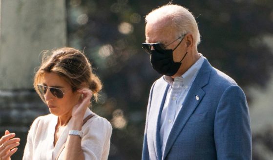 President Joe Biden, right, is pictured in a file photo from October 2021 with his daughter-in-law, Hallie Biden.