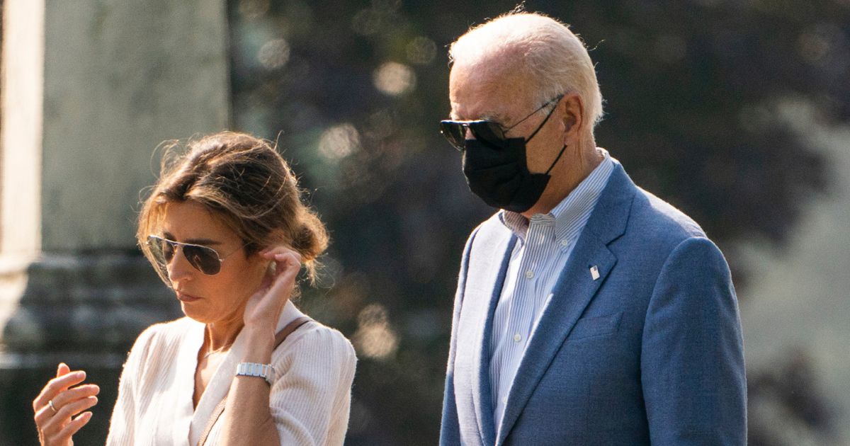 President Joe Biden, right, is pictured in a file photo from October 2021 with his daughter-in-law, Hallie Biden.