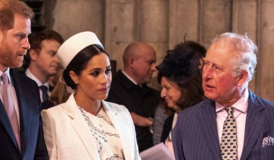 Prince Harry, left, Meghan, Duchess of Sussex, middle, and then-Prince Charles attend the Commonwealth Day service at Westminster Abbey in London on March 11, 2019.