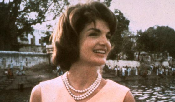 Former first lady Jacqueline Kennedy looks on during a boat ride on Lake Pichola in Udaipur, India, on March 17, 1962.