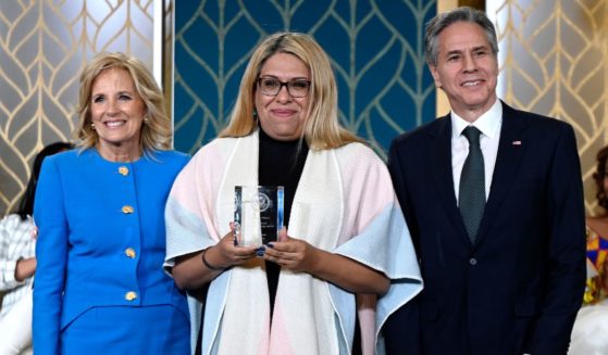 First lady Jill Biden and Secretary of State Antony Blinken pose with Alba Rueda during the 17th annual International Women of Courage Award ceremony in the East Room of the White House in Washington, D.C., on March 8.