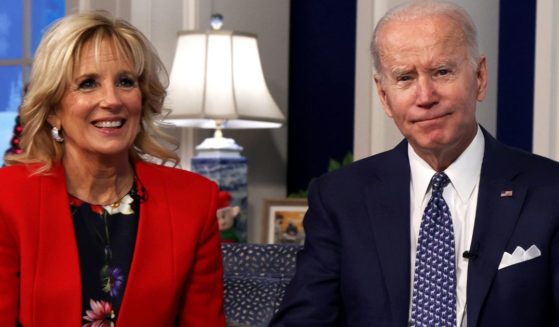 President Joe Biden, right, and first lady Jill Biden, left, participate in an event at the White House, calling NORAD to track the path of Santa Claus on Christmas Eve 2021.