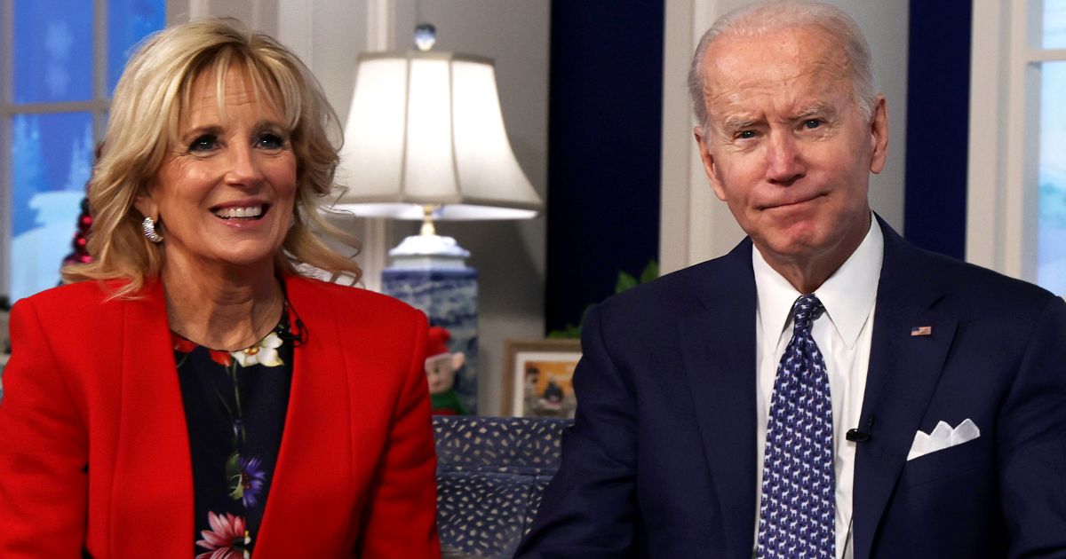 President Joe Biden, right, and first lady Jill Biden, left, participate in an event at the White House, calling NORAD to track the path of Santa Claus on Christmas Eve 2021.