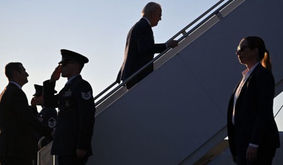 President Joe Biden climbs the stairs to Air Force One at Maxwell Air Force Base, Alabama, after speaking in Selma on Sunday.